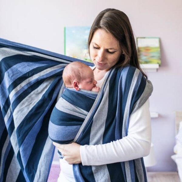 Beautiful,Young,Mother,Wrapping,Her,Son,Into,Sling