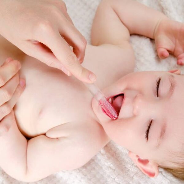 Mother,Hands,Are,Brushing,The,Teeth,Of,A,Happy,Toddler